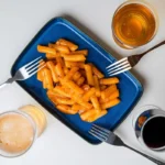 Yopokki Ryžių virtinukai su Sūrio padažu (2 porcijos) 240g (Youngpoong)